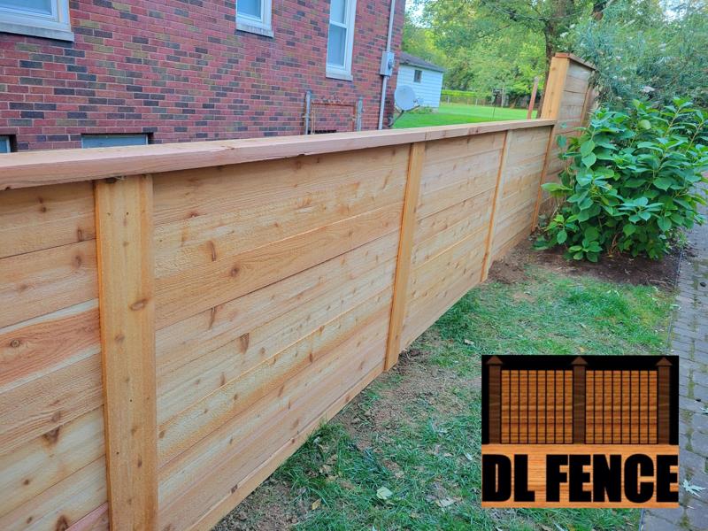 Rear view of horizontal cedar fence and gate in Plainfield, Indiana