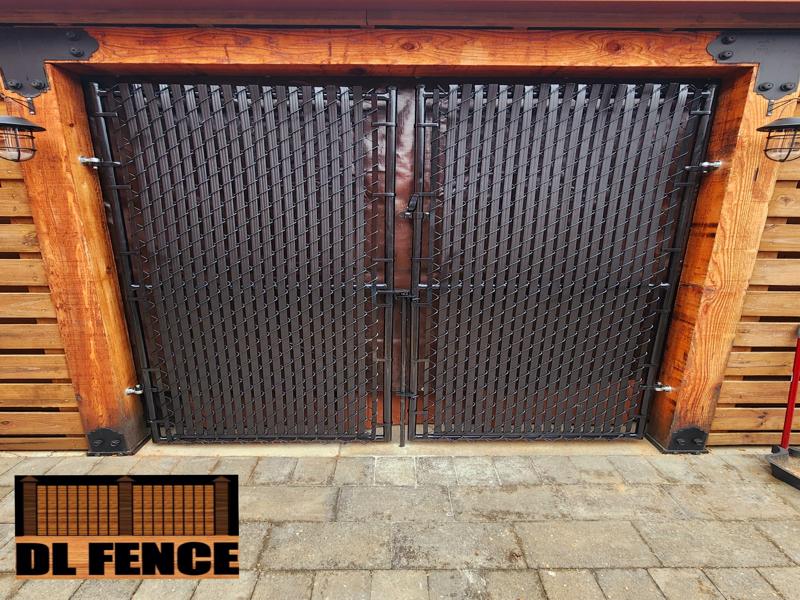 Black chain link fence with decorative gate in Beech Grove, IN