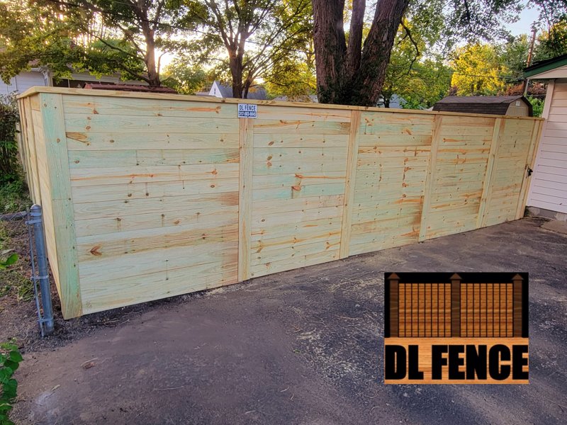 Horizontal board wood fence near driveway in Beech Grove, IN
