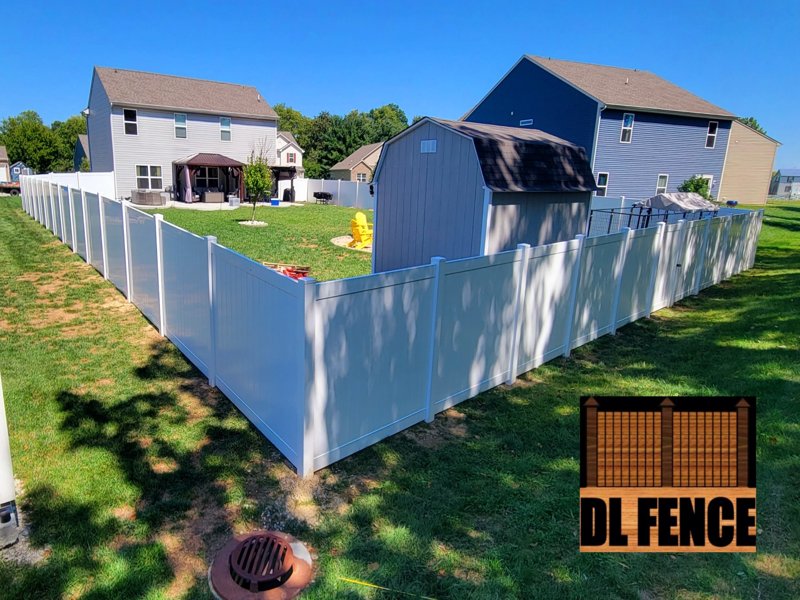 White vinyl fence enclosing backyard in Greenwood, Indiana