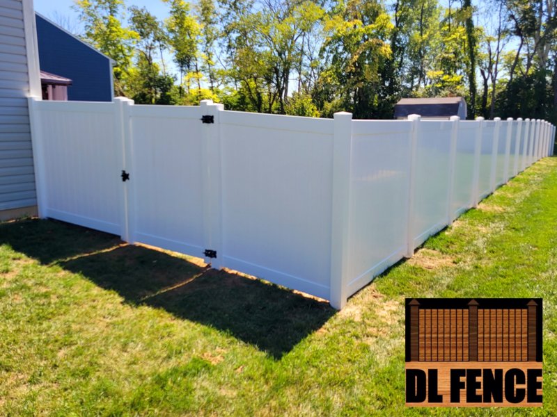 Vinyl privacy fence with black hardware gate in Greenwood, Indiana