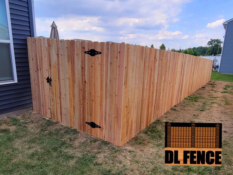 Dog-ear wood privacy fence with black latch in Fishers, IN