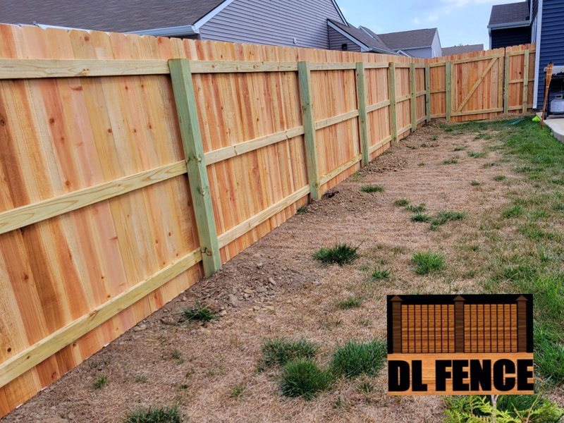 Inside view of wood fence with pressure-treated rails – Fishers, IN