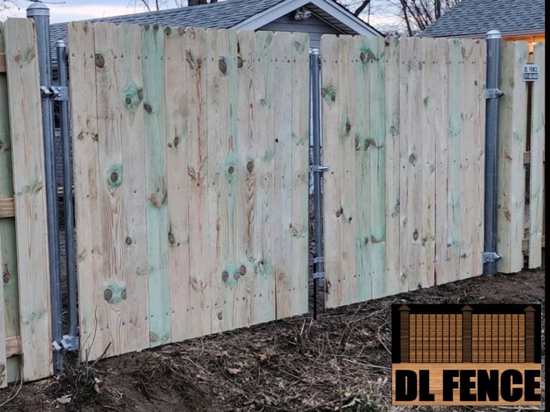 A newly installed wood privacy fence with steel frame support and secure latching system. Built by DL Fence in Indianapolis, IN – 800x600