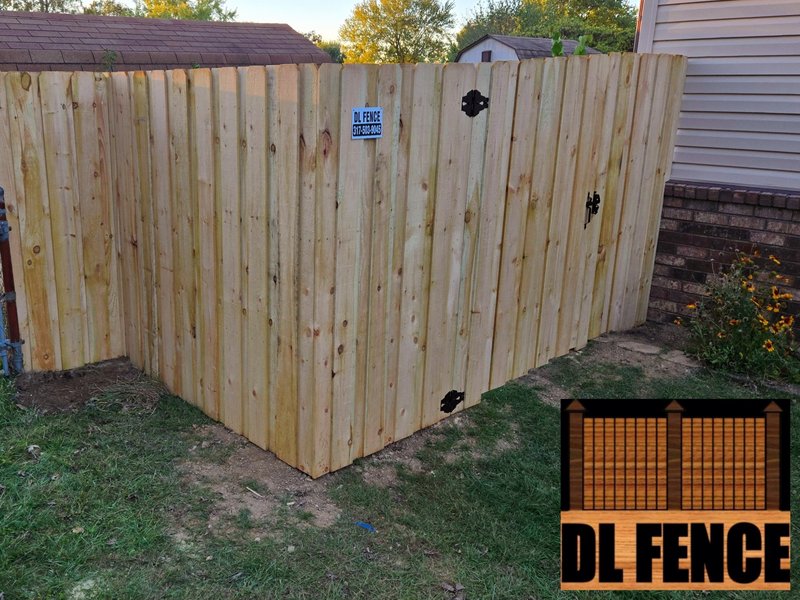 Strong, attractive dog-ear wood privacy fence corner with double gate access. Installed by DL Fence, Indiana – 800x600