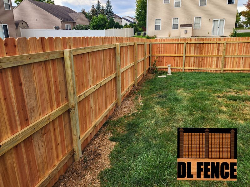 Beautiful cedar wood privacy fence with pressure-treated structural framing. Installed by DL Fence for durability and appeal – 800x600